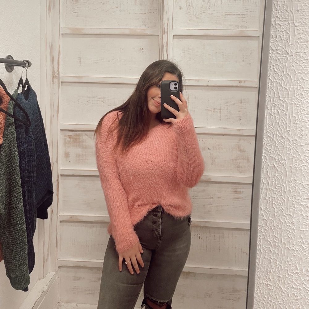 pink fuzzy sweater
